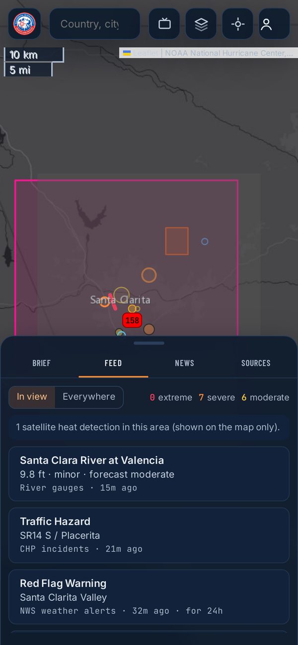The Live Map on a phone over Santa Clarita, with a river gauge, traffic hazard and red flag warning in the feed